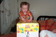 Oli opening his 1st Birthday present from Mummy and Daddy - 8th May