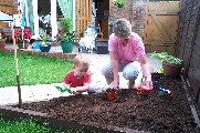 Oli and Nanny digging in Oli's garden