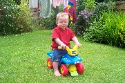 Oli on his ride-on car - 27th June