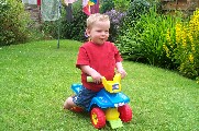 Oli on his ride-on car - 27th June