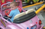 Oli in car on carousel